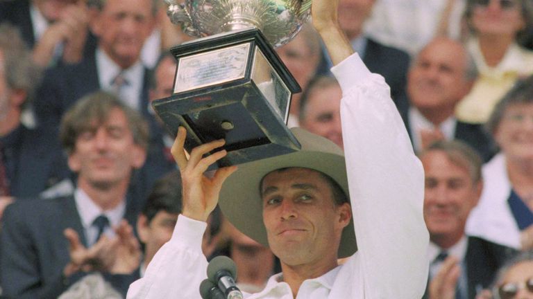 Ivan Lendl holds aloft the Menís singles trophy, which he won at the Australian Open Tennis Championships in Melbourne, Australia, Jan. 28, 1990, Lendl was awarded the trophy when his opponent had to retire with a stomach injury in the third set. (AP Photo/Peter Kemp)