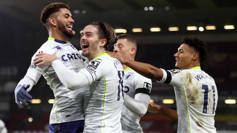 Jack Grealish celebrates with team-mates after scoring Villa's second