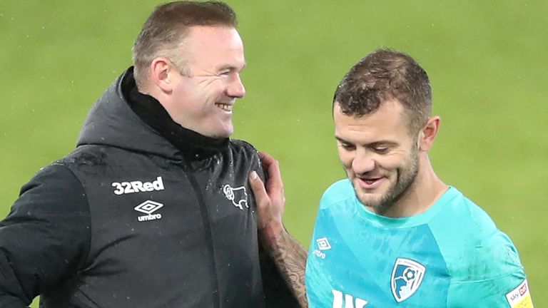 Derby boss Wayne Rooney speaks with Bournemouth midfielder Jack Wilshere 