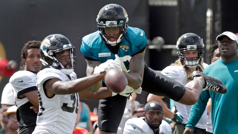 Jacksonville Jaguars cornerback Tae Hayes, left, breaks up a pass intended for wide receiver Terrelle Pryor Sr. during an NFL football practice at the teams training facility, Thursday, Aug. 1, 2019, in Jacksonville, Fla. (AP Photo/John Raoux)