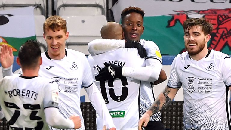 Swansea City's Jamal Lowe (second right) celebrates scoring his side's second goal of the game