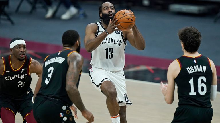 Brooklyn Nets' James Harden (13) shoots against the Cleveland Cavaliers during the second half of an NBA basketball game, Wednesday, Jan. 20, 2021, in Cleveland. (AP Photo/Tony Dejak)