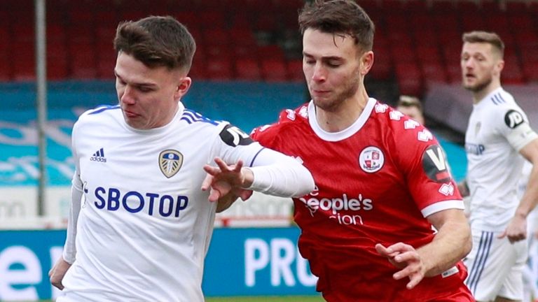 Leeds United's Jamie Shackleton, left, duels for the ball with Crawley Town's Nicholas Tsaroulla - AP photo