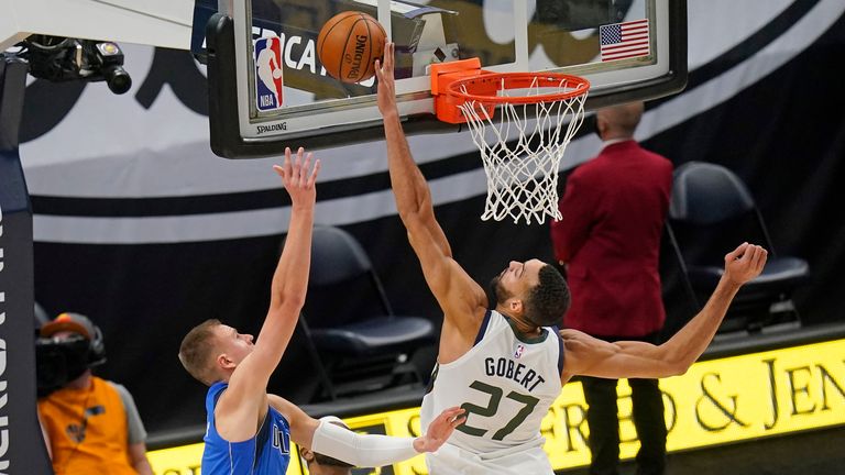 Utah Jazz center Rudy Gobert blocks the shot from Dallas Mavericks forward Kristaps Porzingis