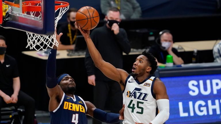 Utah Jazz guard Donovan Mitchell drives to the basket against the Denver Nuggets
