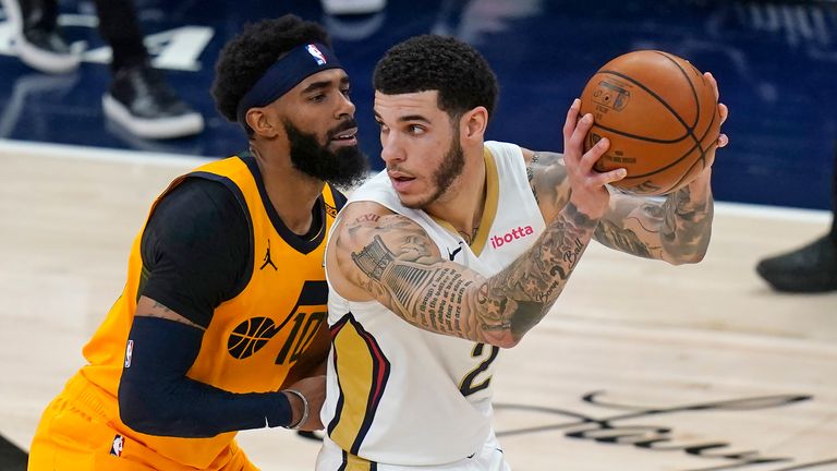 Utah Jazz guard Mike Conley (10) guards New Orleans Pelicans guard Lonzo Ball (2) during the second half during an NBA basketball game Tuesday, Jan. 19, 2021, in Salt Lake City.