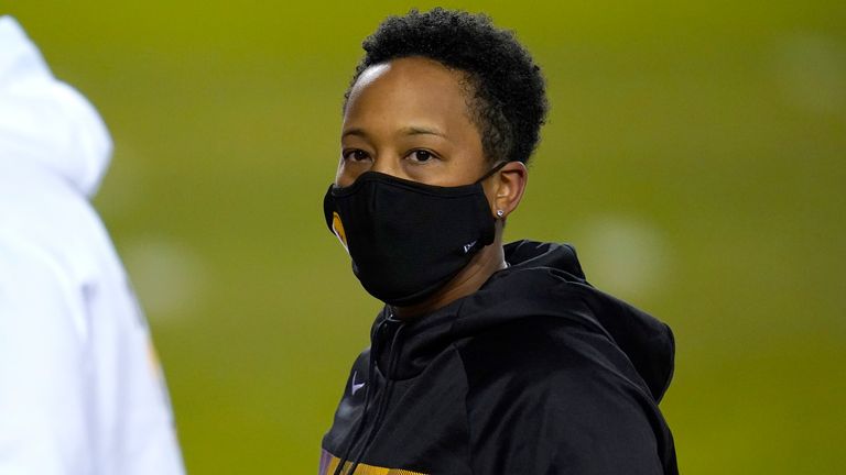 Washington full-year coaching intern Jennifer King looks on prior to an NFL wild-card playoff football game between the Washington Football Team and the Tampa Bay Buccaneers, Saturday, Jan. 9, 2021, in Landover, Md. Tampa Bay won 31-23. (AP Photo/Julio Cortez)