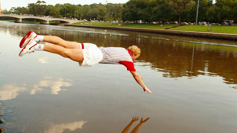 Jim Courier of Dade City, Florida, dives in the Yarra River, after defeating Sweden's Stefan Edberg in the men's final, 6-2, 6-1, 2-6, 7-5, at the Australian Open Tennis Championships, Melbourne, Australia, Sunday, January 31, 1993. (AP Photo/Steve Holland)