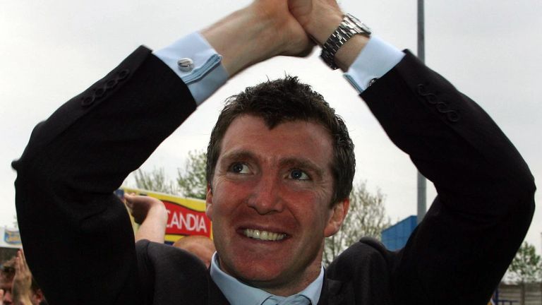 Stockport County's manager Jim Gannon celebrates with fans after avoiding relegation with a draw against Carlisle in the Coca-Cola League Two match at Edgeley Park, Stockport in 2006