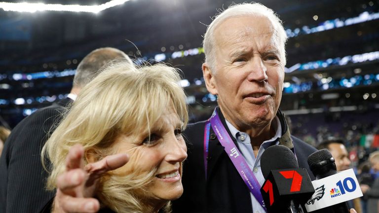 Former Vice President Joe Biden, right, and his wife Jill walk off the field after the NFL Super Bowl 52 football game between the Philadelphia Eagles and the New England Patriots Sunday, Feb. 4, 2018, in Minneapolis. The Eagles won 41-33