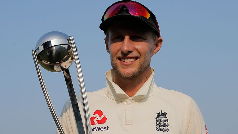 England cricket team captain Joe Root pose with winners trophy after the third test cricket match between Sri Lanka and England in Colombo, Sri Lanka, Monday, Nov. 26, 2018. (AP Photo/Eranga Jayawardena)