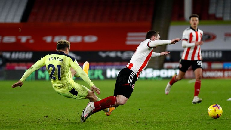 John Fleck is fouled by Ryan Fraser (AP)