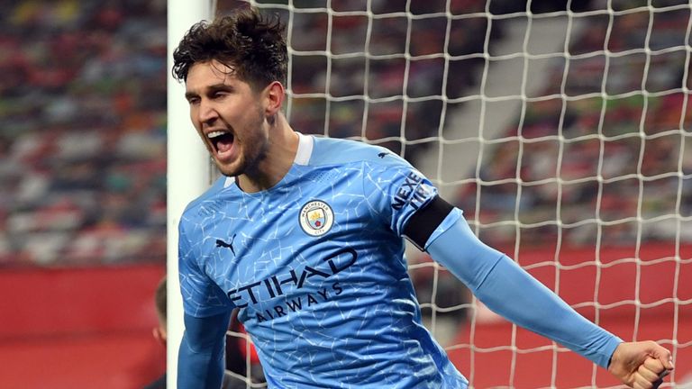 John Stones celebrates after giving Man City the lead at Old Trafford