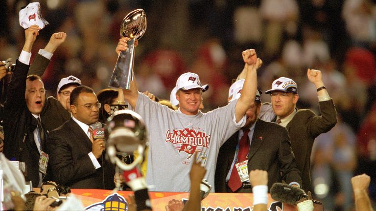 Jon Gruden celebrates wins Super Bowl XXXVII versus the Oakland Raiders in January 2003. (AP Photo/Kevin Reece)