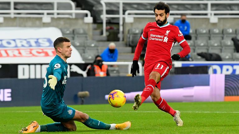 Newcastle goalkeeper Karl Darlow saves a shot from Mohamed Salah