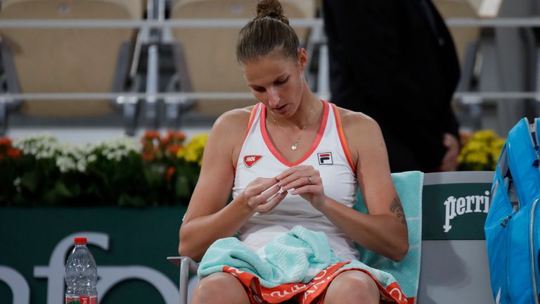 Karolina Pliskova of the Czech Republic takes a break in the second round match of the French Open tennis tournament against Latvia's Jelena Ostapenko at the Roland Garros stadium in Paris, France, Thursday, Oct. 1, 2020. (AP Photo/Alessandra Tarantino)