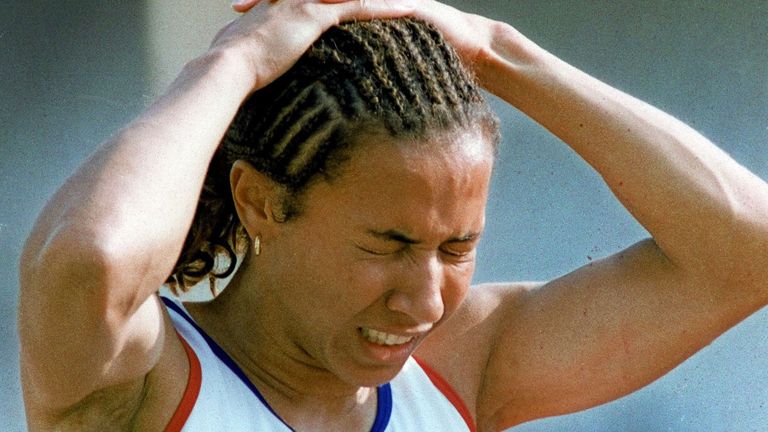 The agony shows for Kelly Holmes today (Saturday) after she was forced out of the 1500m at the IAAF World Championships in Athens due to injury. Photo John Giles.PA.
