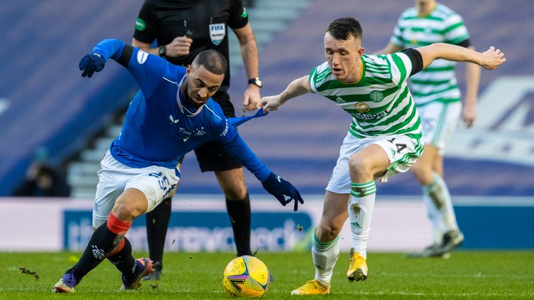 Rangers' Kemar Roofe (left) tussles with Celtic's David Turnbull 