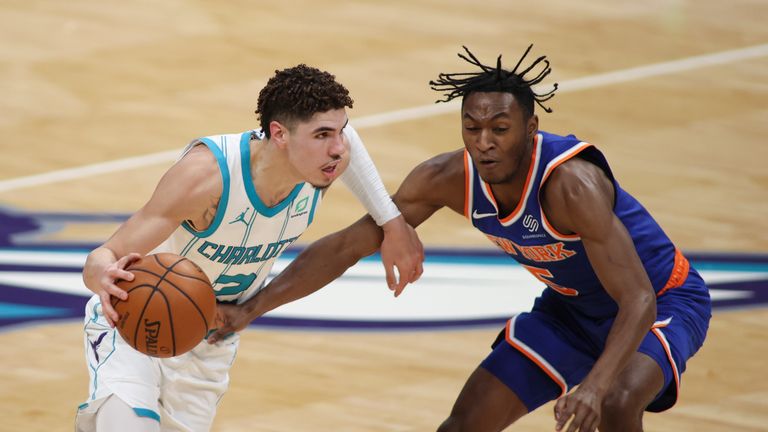 Charlotte Hornets guard LaMelo Ball (2) drives past New York Knicks guard Immanuel Quickley (5) in the second half of an NBA basketball game in Charlotte, N.C., Monday, Jan. 11, 2021. Charlotte won 109-88.