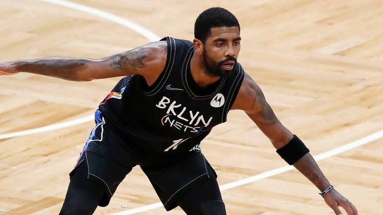 Brooklyn Nets' Kyrie Irving plays against the Boston Celtics during the first half of an NBA basketball game, Friday, Dec. 25, 2020, in Boston. (AP Photo/Michael Dwyer)