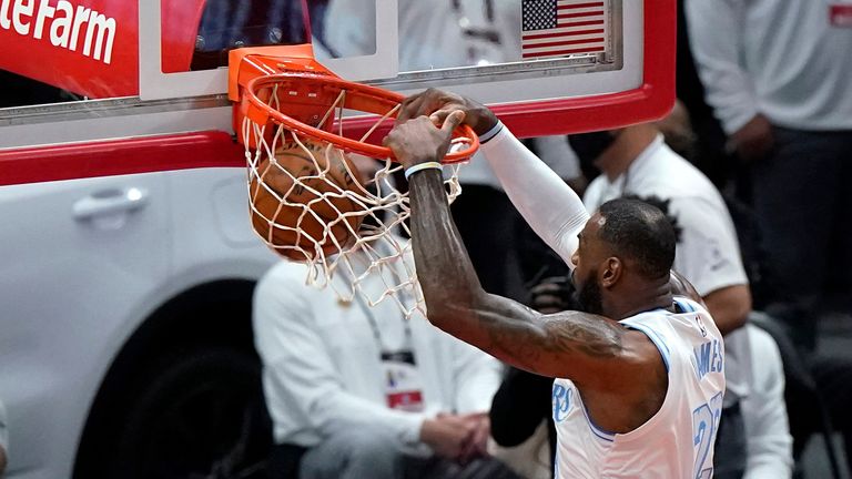 Los Angeles Lakers forward LeBron James dunks against the Chicago Bulls during the first half of an NBA basketball game in Chicago, Saturday, Jan. 23, 2021.