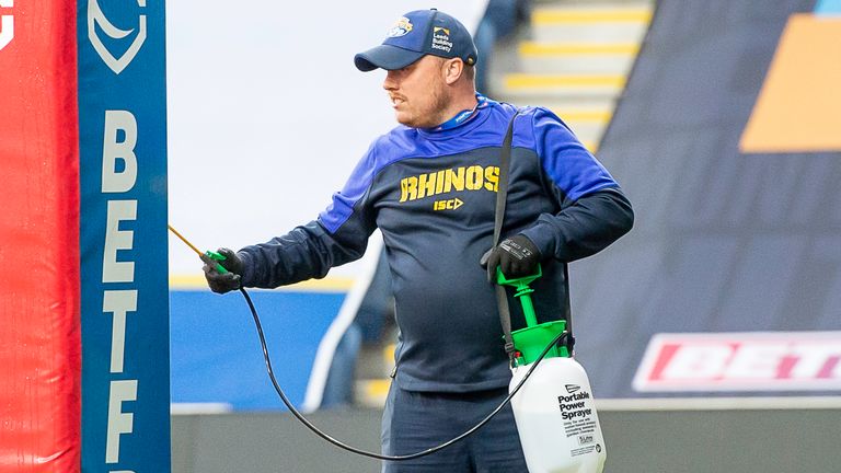 Picture by Allan McKenzie/SWpix.com - 09/08/2020 - Rugby League - Betfred Super League - Salford Red Devils v Hull FC - Emerald Headingley Stadium, Leeds, England - Staff spray the posts with disinfectant against Coronavirus.