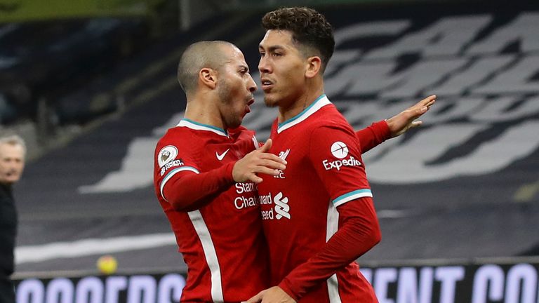 Liverpool's Roberto Firmino celebrates scoring the first goal with team-mate Thiago Alcantara