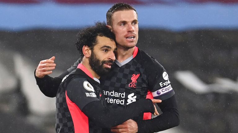Mohamed Salah is congratulated by Jordan Henderson after his second strike