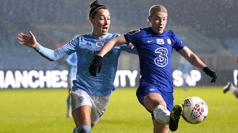 Manchester City's Lucy Bronze battles for the ball with Chelsea's Beth England during their League Cup quarter-final