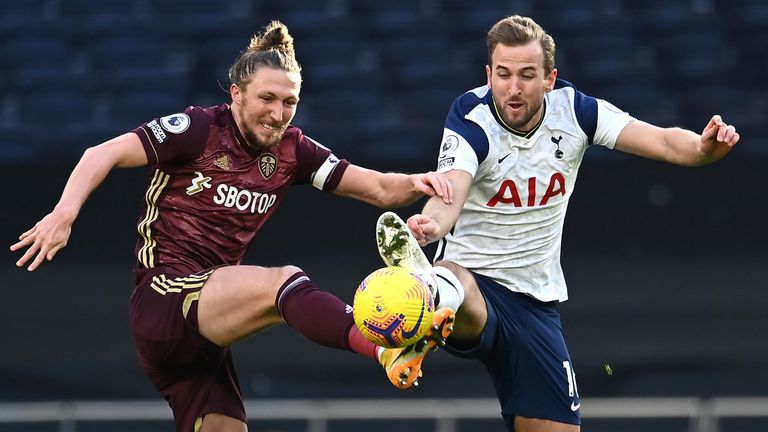 Luke Ayling and Harry Kane battle for the ball 