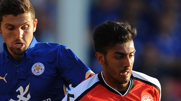 Walsall's Mal Benning (right) and Leicester City's James Pearson (left) battle for the ball during the pre-season friendly at the Bescot Stadium, Walsall. PRESS ASSOCIATION Photo. Picture date: Wednesday July 30, 2014. See PA story SOCCER Walsall. Photo credit should read: Nigel French/PA Wire
