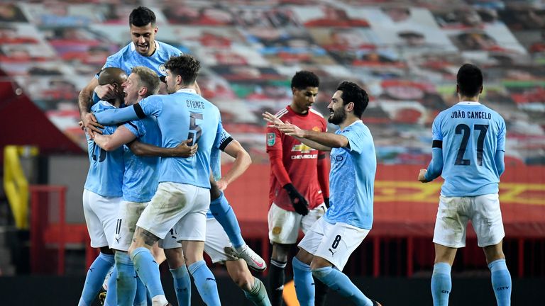 Manchester City celebrate their second goal in the Carabao Cup win over Manchester United (AP)