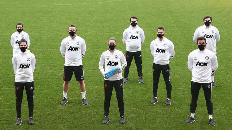 Manchester United Women's boss Casey Stoney celebrates her Manager of the Month award with her backroom staff