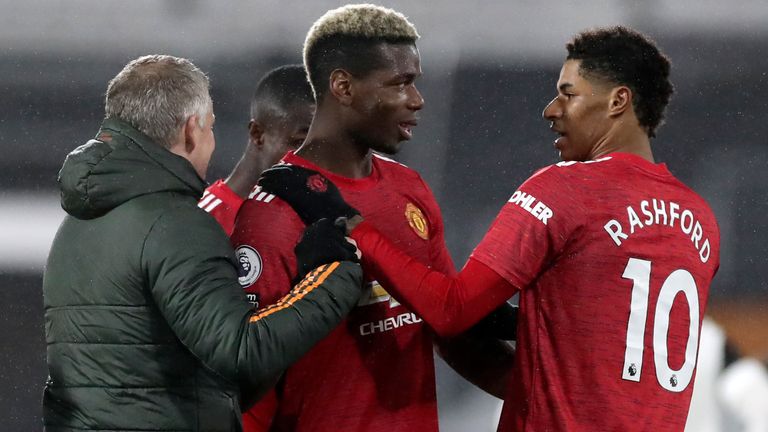 Ole Gunnar Solskjaer congratulates Paul Pogba at full-time at Fulham