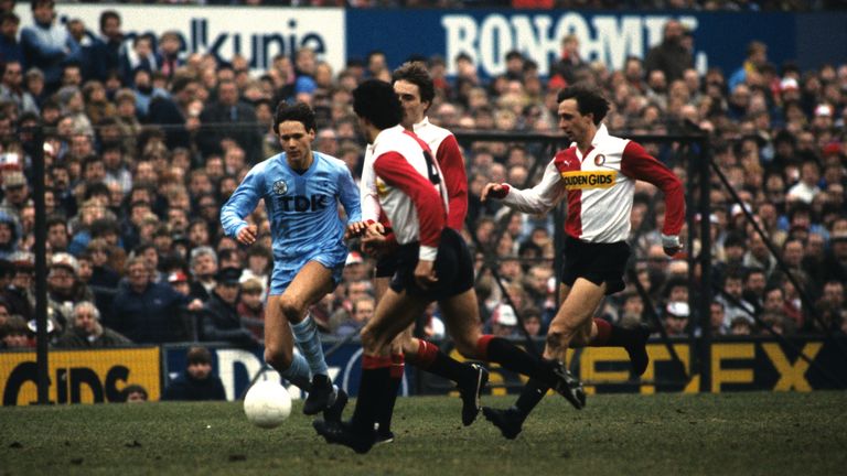 Ajax's Marco van Basten runs at the Feyenoord defence, including Johan Cruyff in an Eredivisie match between the teams in 1984