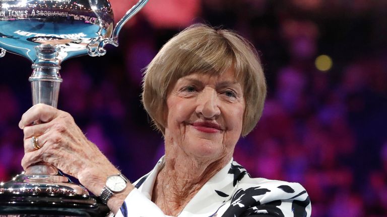 Margaret Court holds up the Australian Open trophy in 2020 fifty years on from winning four Grand Slams in the calendar year