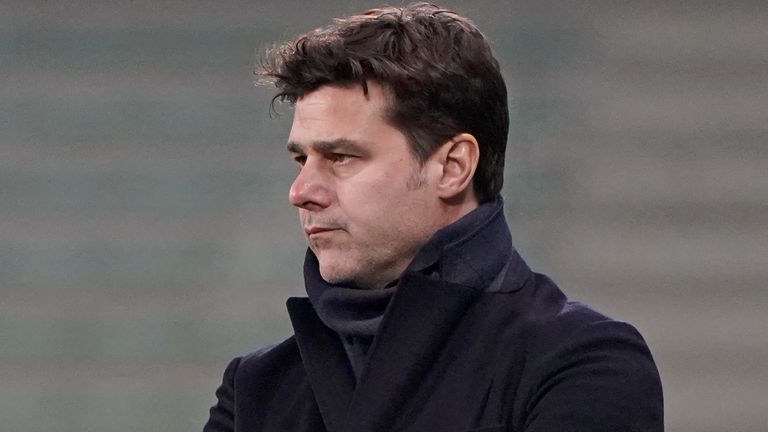 PSG's head coach Mauricio Pochettino watches from the touchline during the French League One soccer match between Saint-Etienne and Paris Saint-Germain at the Geoffroy Guichard stadium, in Saint-Etienne, central France, Wednesday, Jan. 6, 2021. (AP Photo/Laurent Cipriani)