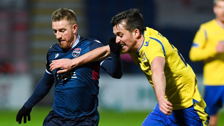 Ross County's Michael Gardyne and St Johnstone's Callum Booth tussle