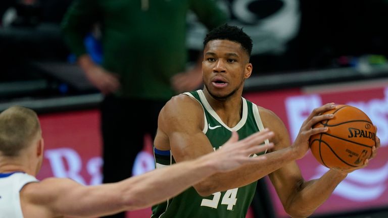 Milwaukee Bucks forward Giannis Antetokounmpo (34) looks to pass during the first half of an NBA basketball game against the Detroit Pistons, Wednesday, Jan. 13, 2021, in Detroit. (AP Photo/Carlos Osorio)


