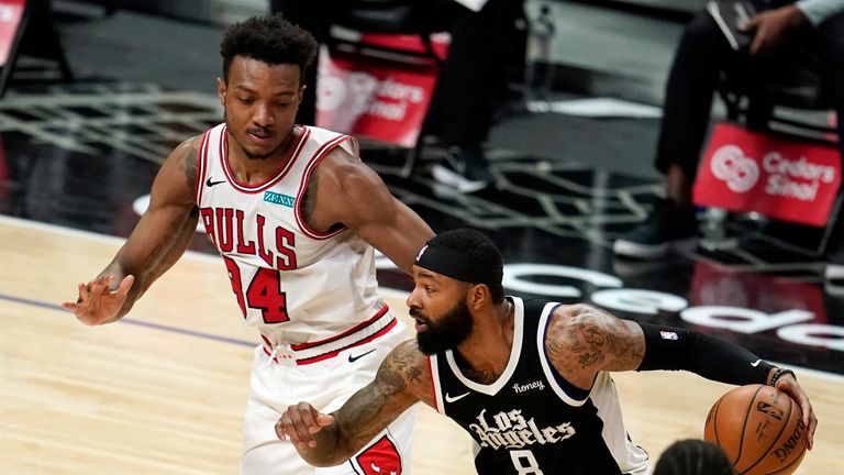 Los Angeles Clippers forward Marcus Morris Sr. (8) dribbles past Chicago Bulls center Wendell Carter Jr. during the second half of an NBA basketball game Sunday, Jan. 10, 2021, in Los Angeles. (AP Photo/Marcio Jose Sanchez)


