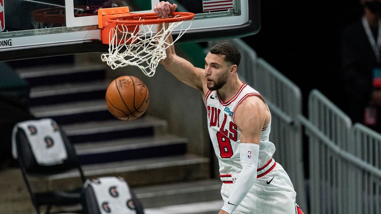 Chicago Bulls guard Zach LaVine (8) dunks the ball against the Charlotte Hornets during the first half of an NBA basketball game in Charlotte, N.C., Friday, Jan. 22, 2021.