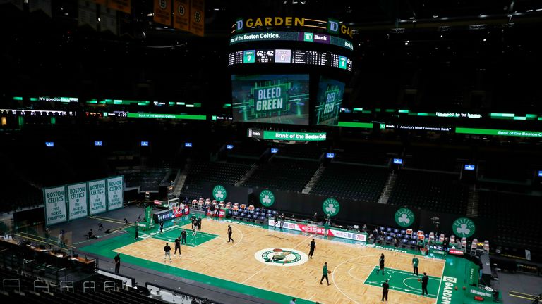 The Boston Celtics and the Milwaukee Bucks warm up before an NBA basketball game, Wednesday, Dec. 23, 2020, in Boston. (AP Photo/Michael Dwyer)


