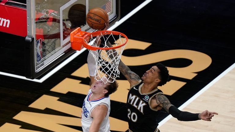 Los Angeles Clippers guard Luke Kennard (5) has his shot blocked by Atlanta Hawks forward John Collins (20) in the second half of an NBA basketball game Tuesday, Jan. 26, 2021, in Atlanta. (AP Photo/John Bazemore)


