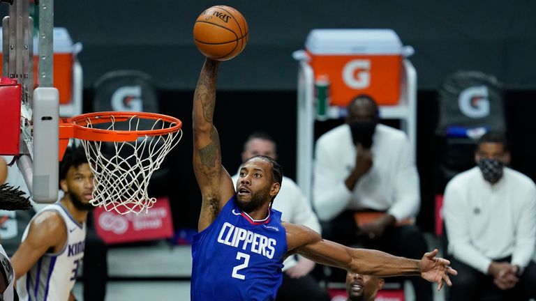 Los Angeles Clippers forward Kawhi Leonard (2) dunks the ball during the first quarter of an NBA basketball game against the Sacramento Kings Wednesday, Jan. 20, 2021, in Los Angeles. 