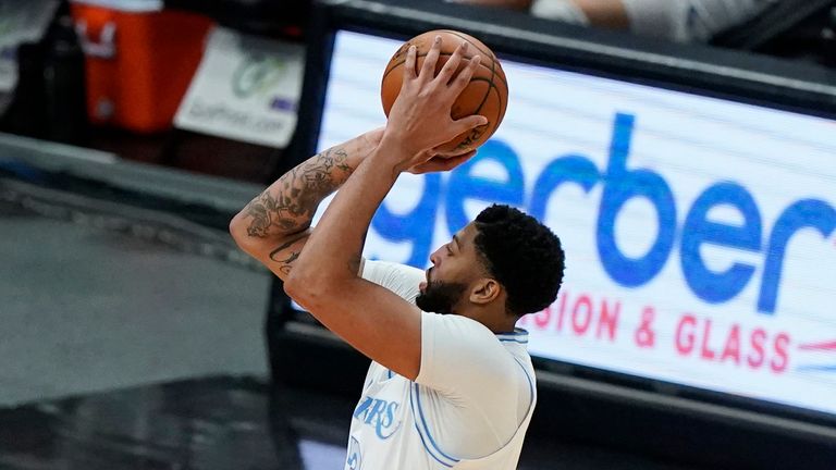 Los Angeles Lakers forward Anthony Davis, right, shoots against Chicago Bulls forward Thaddeus Young during the first half of an NBA basketball game in Chicago, Saturday, Jan. 23, 2021.