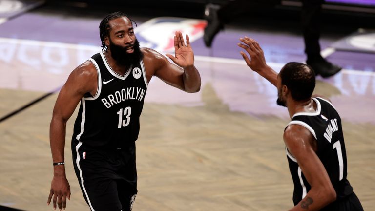 Brooklyn Nets guard James Harden celebrates with forward Kevin Durant (7) during the second half of an NBA basketball game against the Milwaukee Bucks, Monday, Jan. 18, 2021, in New York. (AP Photo/Adam Hunger)


