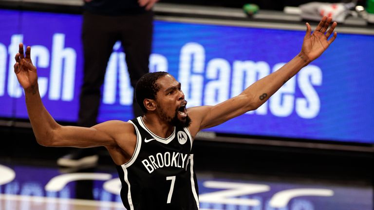 Brooklyn Nets forward Kevin Durant reacts against the Milwaukee Bucks during the first half of an NBA basketball game Monday, Jan. 18, 2021, in New York. (AP Photo/Adam Hunger)


