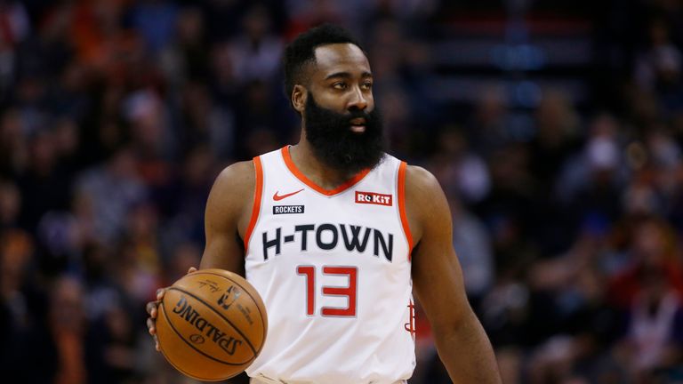 Houston Rockets guard James Harden dribbles the ball against the Phoenix Suns during the first half of an NBA basketball game Saturday, Dec. 21, 2019, in Phoenix. The Rockets defeated the Suns 139-125. (AP Photo/Ross D. Franklin)


