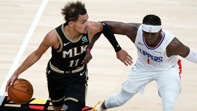 Atlanta Hawks guard Trae Young (11) drives against Los Angeles Clippers guard Reggie Jackson (1) in the second half of an NBA basketball game Tuesday, Jan. 26, 2021, in Atlanta. (AP Photo/John Bazemore)


