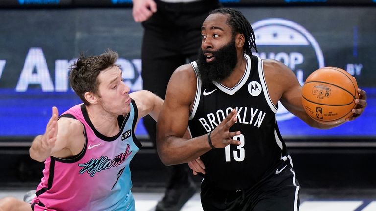Miami Heat&#39;s Goran Dragic, left, defends against Brooklyn Nets&#39; James Harden, right, during the first half of an NBA basketball game Saturday, Jan. 23, 2021, in New York.